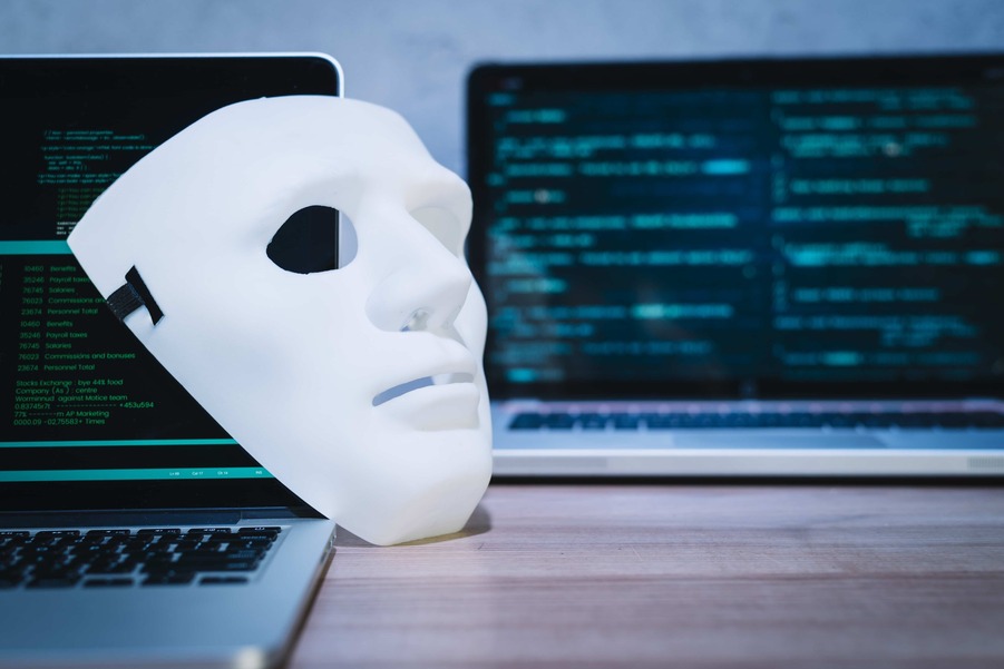 Hacker mask with system codes in the background